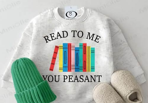 The Phrase on Baby Clothes: "Read to Me, You Peasant" - Los Angeles - 1
